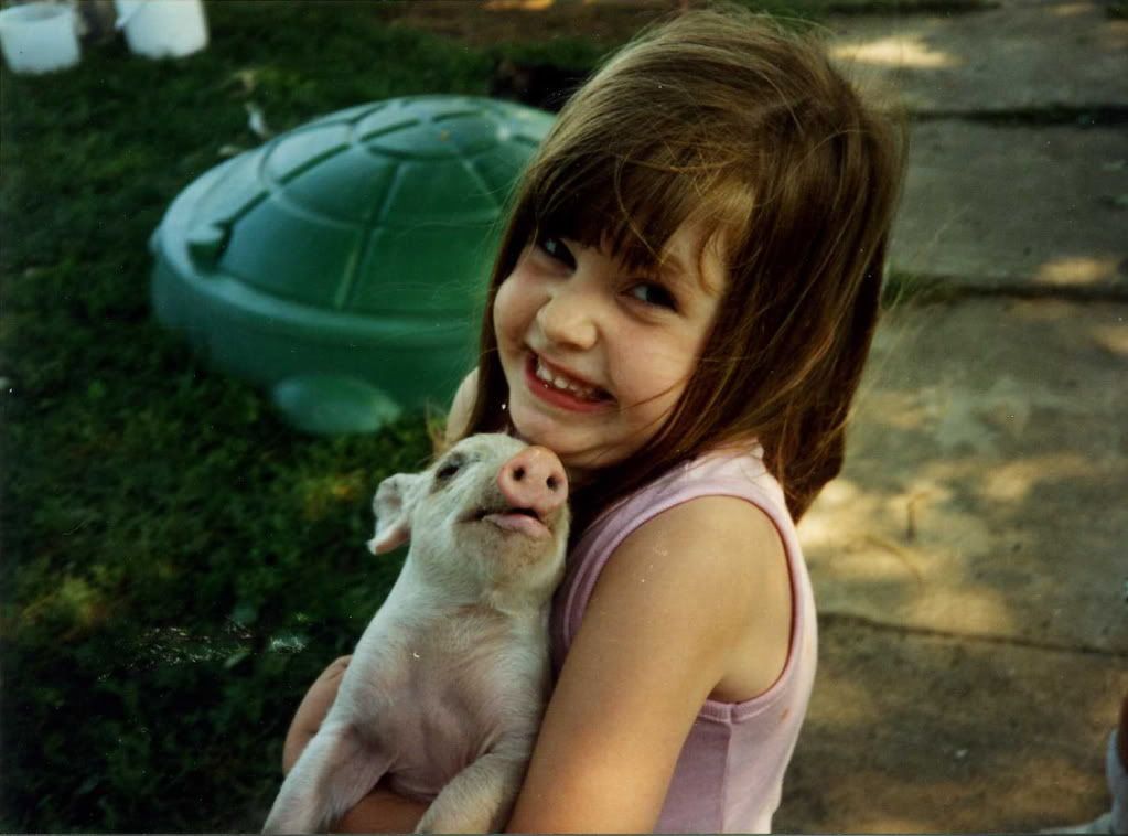 6AnneMarieholdingpigaround6yrs.jpg Anne Marie holding pig around six years old image by SonriseRabbitry