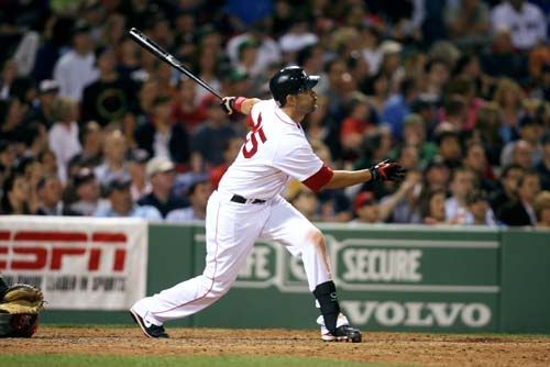 Mike Lowell hits a double off the left field wall, scoring J.D. Drew, in the 6th inning - Journal photo / Bob Breidenbach