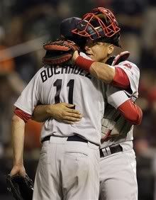 Boston Red Sox  starting pitcher Clay Buchholz (11) is hugged by catcher Victor Martinez after the Red Sox defeated the Baltimore Orioles  11-0 during a baseball game, Friday, June 4, 2010, in Baltimore - AP Photo