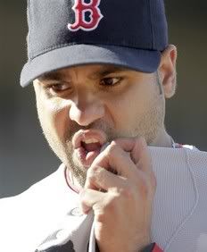 Boston Red Sox relief pitcher Manny Delcarmen is taken out of the game against the San Francisco Giants in the sixth inning of an interleague baseball game in San Francisco, Saturday, June 26, 2010.