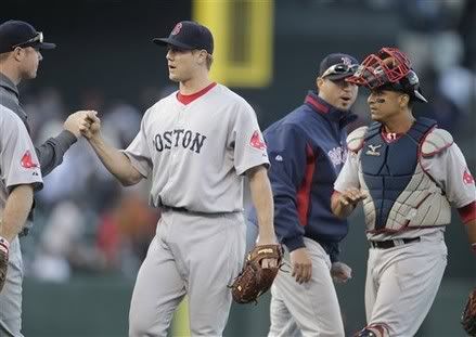 Boston Red Sox relief pitcher Jonathan Papelbon, left, and catcher Victor Martinez, right, celebrates with teammates after a 4-2 victory against the San Francisco Giants in a interleague baseball game in San Francisco, Saturday, June 26, 2010.