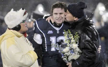 Huskies punter Desi Cullen gets a kiss from his father during Senior Night festivities at Rentschler Field on Saturday before UConn's game against South Florida (Stephen Dunn/Hartford Courant)