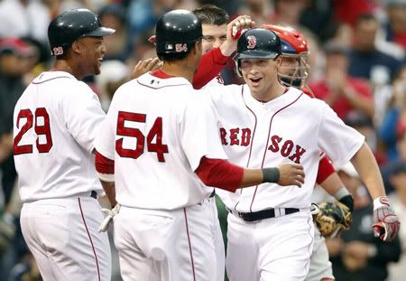 Boston  Red Sox Daniel Nava (R) is congratulated by teammates Jason Varitek, Adrian Beltre (29) and Darnell McDonald (54) in front of Philadelphia Phillies catcher Brian Schneider after hitting a grand slam during the second inning of their Interleague MLB baseball game at Fenway Park in Boston, Massachusetts  June 12, 2010 - Reuters Pictures