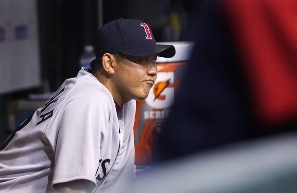 Boston Red Sox pitcher Daisuke Matsuzaka sits in the dugout after being relieved from the game against the Tampa Bay Rays during the sixth inning of their MLB American League baseball game in St. Petersburg, Florida  July 5, 2010.