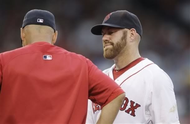 Boston Red Sox first baseman Kevin Youkilis, right, talks with manager Terry Francona at the start of the second inning against Cleveland Indians  in a baseball game in Boston, Monday, Aug. 2, 2010. Youkilis jammed his right thumb during his first-inning at-bat and left the game at the start of the second.