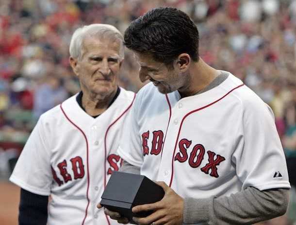 Former Boston Red Sox Nomar Garciapara and Johnny Pesky (L) attend a pre-game ceremony to honor Garciapara before the Boston Red Sox take on the Los Angeles Angels in their American League MLB baseball game at Fenway Park in Boston, Massachusetts May 5, 2010 (Reuters Pictures)