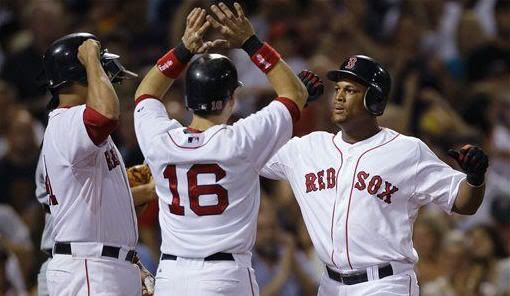 Boston Red Sox's Adrian Beltre, right, is congratuated by teammates Marco Scutaro (16) and Victor Martinez, left, after his grand slam off Cleveland Indians starter Josh Tomlin in the fourth inning of a baseball game in Boston, Thursday, Aug. 5, 2010. (AP Photo/Charles Krupa)