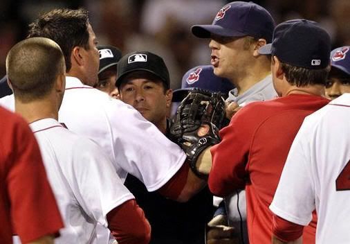 Cleveland Indians' Shelley Duncan, right, has words with Boston Red Sox starting pitcher Josh Beckett, left, who grabs his jersey in the eighth inning of a baseball game at Fenway Park in Boston Tuesday, Aug. 3, 2010. Both benches cleared with pushing and shoving after Jensen Lewis threw a pitch behind Adrian Beltre. Lewis, Beckett and Indians third-base coach Steve Smith were ejected from the game. (AP Photo/Elise Amendola)