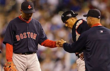 Boston Red Sox's Hideki Okajima, left, is taken out of the game by manager Terry Francona, right, during the eighth inning of a major league baseball game against the Kansas City Royals Friday, April 9, 2010, in Kansas City, Mo. The Royals defeated the Red Sox 4-3. (AP Photo/Orlin Wagner)