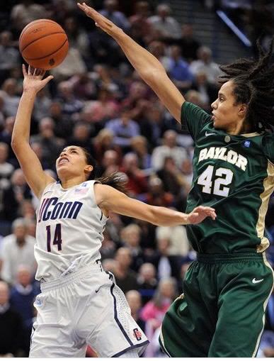 Baylor's Brittney Griner, right, defends on a shot by Connecticut's Bria Hartley during the second half of Connecticut's 65-64 victory in an NCAA college basketball game in Hartford, Conn., on Tuesday, Nov. 16, 2010.