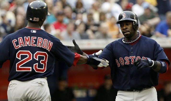 TORONTO - JULY 9: Mike Cameron #23 and Bill Hall #22 of the Boston Red Sox celebrate Hall's 2-run home run during a MLB game against the Toronto Blue Jays at The Rogers Centre on July 9, 2010 in Toronto, Ontario, Canada. (Photo by Abelimages/Getty Images)