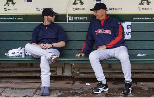 Boston Red Sox's Dustin Pedroia, left, and manager Terry Francona talk in the dugout before a baseball game against the Oakland Athletics in Oakland, Calif., Wednesday, July 21, 2010. (AP Photo/Jeff Chiu)