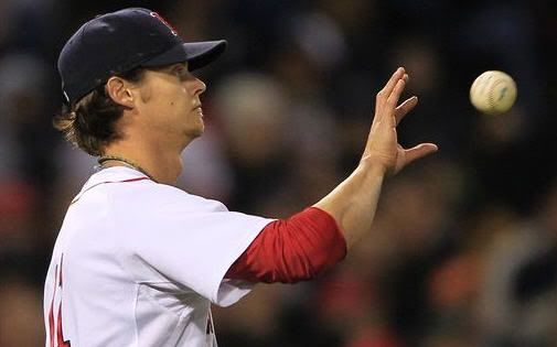 Boston Red Sox starter Clay Buchholz catches the ball from an infield after Texas Rangers' David Murphy drove in the second run of the seventh inning of a baseball game at Fenway Park in Boston, Thursday, April 22, 2010. Buchholz allowed three earned runs and committed a throwing error during the inning. (AP Photo/Charles Krupa)