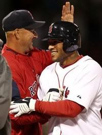 Boston Red Sox manager Terry Francona congratulates Darnell McDonald after McDonald's walk-off single won the game 7-6 in the bottom of the ninth inning over the Texas Rangers in a MLB baseball game at Fenway Park in Boston Tuesday, April 20, 2010. (AP Photo/Winslow Townson)