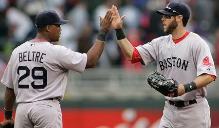 Boston Red Sox left fielder Jeremy Hermida, right, is congratulated by Adrian Beltre after the Sox defeated the Minnesota Twins 6-3 in a baseball game Wednesday, April 14, 2010 in Minneapolis.(AP Photo/Andy King)