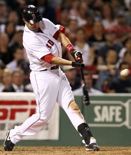 Boston Red Sox's Mike Lowell hits a two-run double during the third inning of a MLB baseball game against the Los Angeles Angels at Fenway Park in Boston Monday, May 3, 2010. (AP Photo/Winslow Townson)