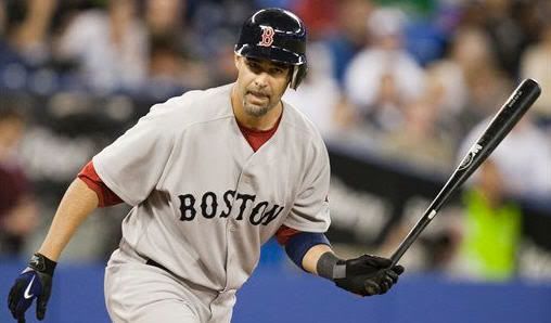 Boston Red Sox pinch hitter Mike Lowell throws his bat as he is walked with bases loaded for the game winning run by Toronto Blue Jays pitcher Kevin Gregg during the eighth inning of a baseball game against the Toronto Blue Jays in Toronto on Tuesday, April 27, 2009. (AP Photo/The Canadian Press, Frank Gunn)