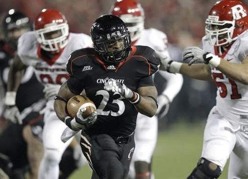 Cincinnati running back Isaiah Pead (23) runs for a 24-yard touchdown against Rutgers in the first half of an NCAA college football game, Saturday, Nov. 20, 2010, in Cincinnati.