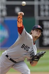 Boston Red Sox's Clay Buchholz pitches against the Oakland Athletics in the first inning of a baseball game in Oakland, Calif., Wednesday, July 21, 2010. (AP Photo/Jeff Chiu)