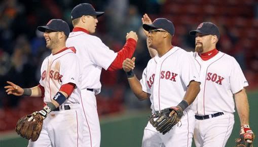 Boston Red Sox closer Jonathan Papelbon, second from left, celebrates with teammates, from left, Dustin Pedroia, Adrian Beltre and Kevin Youkilis after beating the Toronto Blue Jays 7-6 in a baseball game, Monday, May 10, 2010, in Boston. (AP Photo/Michael Dwyer)