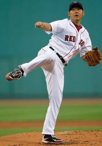 Boston Red Sox starter Daisuke Matsuzaka follows through as he delivers against the Kansas City Royals during the first inning of a baseball game at Fenway Park in Boston, Thursday, May 27, 2010. (AP Photo/Charles Krupa)