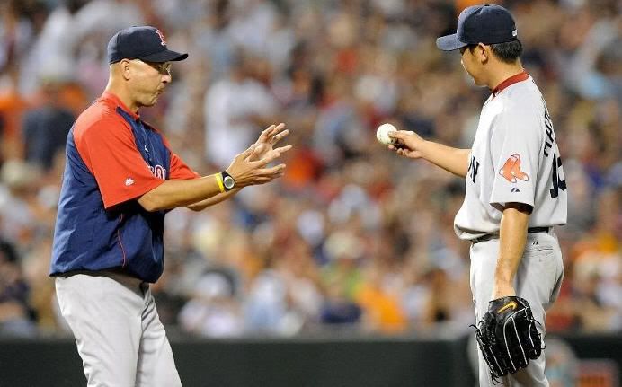 Manager Terry Francona of the Boston Red Sox removes Daisuke Matsuzaka #18 in the fifth inning of the game against the Baltimore Orioles at Camden Yards on May 1, 2010 in Baltimore, Maryland. (Photo by Greg Fiume/Getty Images)