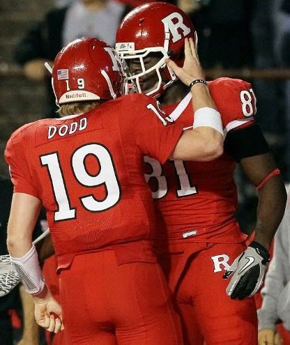 Mark Harrison #81 of the Rutgers Scarlet Knights celebrates his game-tying touchdown against the Connecticut Huskies with teammate Chas Dodd #19 at Rutgers Stadium on October 8, 2010 in Piscataway, New Jersey. Rutgers defeated UConn 27-24. (Photo by Jim McIsaac/Getty Images)