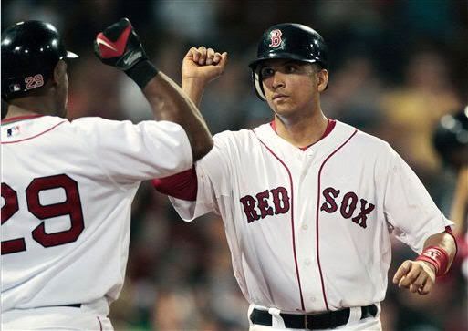 Boston Red Sox's Victor Martinez, right, celebrates with Adrian Beltre after scoring on a single by Kevin Youkilis in the eighth inning of a baseball game against the Oakland Athletics, Tuesday, June 1, 2010, in Boston. The Red Sox won 9-4. (AP Photo/Michael Dwyer)