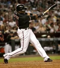 Arizona Diamondbacks' Justin Upton connects for a triple against the Florida Marlins during the fifth inning of a baseball game, Saturday, July 11, 2009, in Phoenix - AP Photo