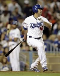 Los Angeles Dodgers' Andre Ethier follows through on his RBI-double off San Diego Padres pitcher Luis Perdomo in the sixth inning of a baseball game in Los Angeles, on Saturday, Sept. 5, 2009. - AP Photo