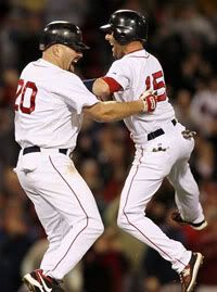Boston Red Sox's Kevin Youkilis (20) is greeted by Dustin Pedroia after Youkilis' double in the bottom of the 12th inning of Boston's 8-7 win over the Texas Rangers in a baseball game at Fenway Park in Boston on Wednesday, April 21, 2010. (AP Photo/Winslow Townson)