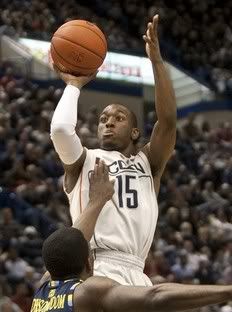 Connecticut's Kemba Walker shoots over Marquette's Darius Johnson-Odom during first half of an NCAA college basketball game in Hartford, Conn. , on Saturday, Jan. 30, 2010.