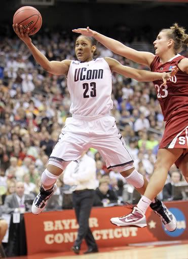 Forward Maya Moore #23 of the Connecticut Huskies takes a shot against Jeanette Pohlen #23 of the Stanford Cardinal during the NCAA Women's Final Four Championship game at the Alamodome on April 6, 2010 in San Antonio, Texas. 