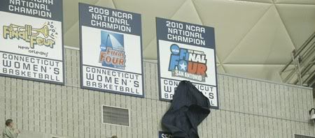 The Connecticut Huskies unveil the 2010 NCAA National Champion banner before the start of the game against the Holy Cross Crusaders at Gampel Pavilion. UConn defeated Holy Cross 117-37. 