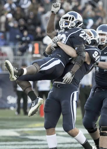 UConn tight end Ryan Griffin hoists Jordan Todman after Todman scored his second of three touchdowns Saturday against Cincinnati. 