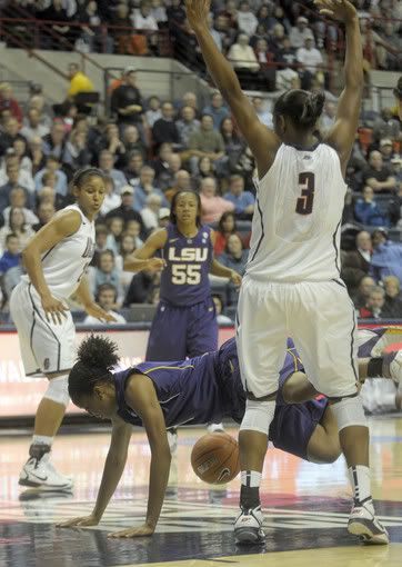 LSU's Katherine Graham was called for a foul on this play against Tiffany Hayes, 3, of UConn. In the background is UConn's Maya Moore, and LSU's LaSondra Barrett, 55. The University of Connecticut played LSU in the final game of the World Vision Challenge at the Gampel Pavilion in Storrs.