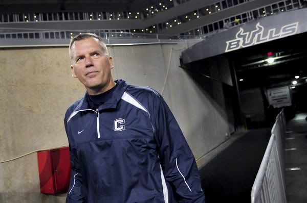 UConn coach Randy Edsall walks out onto the football field at the Raymond James Stadium in Tampa Saturday before the start of the Huskies'game against South Florida. 