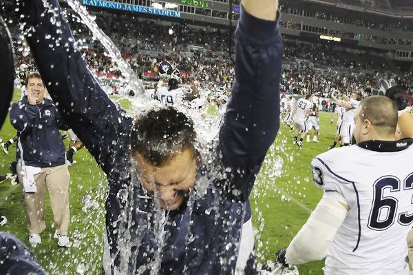 UConn head coach Randy Edsall gets hit with water after the Huskies beat the University of South Florida 19-16 at the Raymond James Stadium in Tampa Saturday for the last game of the regular season. With the win, they have earned a BCS berth. 