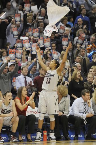 Maya Moore tosses her towel as the final seconds tick off the clock and UConn wins it's 89th straight game, breaking the record of 88 in a row set by the UCLA men in 1974. The Huskies beat Florida State 93-61 Tuesday night at the XL Center.