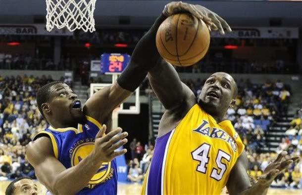 Golden State Warriors forward Jeff Adrien, left, and Los Angeles Lakers forward Derrick Caracter go after a rebound during the second half of their NBA basketball game, Friday, Oct. 22, 2010, in Ontario, Calif.