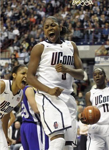 Connecticut's Tiffany Hayes celebrates after making a basket and being fouled by a Holy Cross player during the first half of a NCAA college basketball game, in Storrs, Conn., Sunday, Nov. 14, 2010. Hayes had 30 points in the first half. 