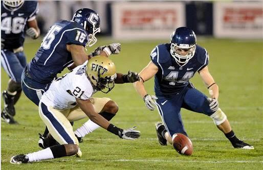 Connecticut's Robbie Frey, right, recovers a Pittsburgh fumble as teammate Jerome Junior (15) and Pittsburgh's Buddy Jackson look on during the second half of an NCAA college football game in East Hartford, Conn., on Thursday, Nov. 11, 2010. The recovery set up a Connecticut touchdown. Connecticut won 30-28. (AP Photo/Fred Beckham)