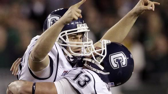 Dave Teggart celebrates with Chad Christen after kicking game-winning field goal against South Florida to send UConn to a BCS Bowl.