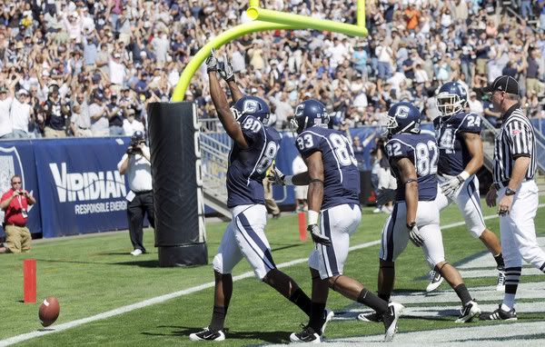  UConn receiver Michael Smith celebrates UConn's first home touchdown of the season against Texas Southern at Rentschler Field.