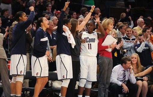 Connecticut celebrates in the final seconds of its 81-50 win over Ohio State in an NCAA college basketball game in the Maggie Dixon Classic at Madison Square Garden in New York, Sunday, Dec. 19, 2010.