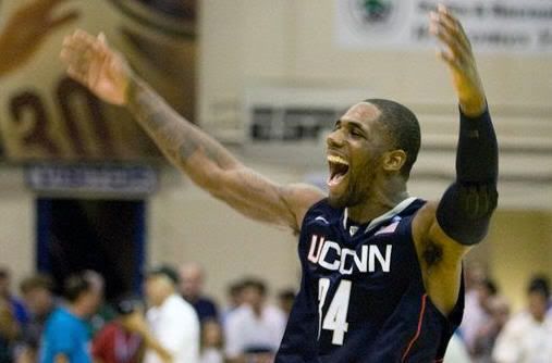 Connecticut's Alex Oriakhi celebrates after his team defeated Michigan State 70-67 in a Maui Invitational NCAA college basketball game, in Lahaina, Hawaii Tuesday, Nov. 23, 2010.