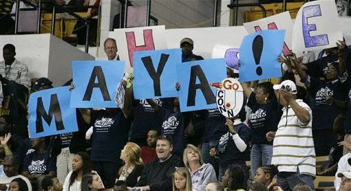 Fan's of Connecticut forward Maya Moore (23) hold up a sign welcoming her home during an NCAA basketball game, Sunday, Nov. 21, 2010, in Atlanta. Connecticut won 71-51