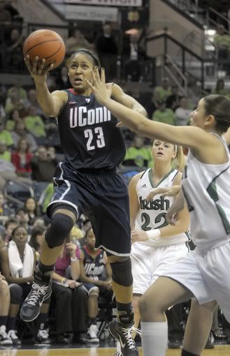 UConn forward Maya Moore takes it to the cup in the second half against Notre Dame Saturday in South Bend, Ind.