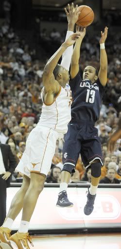 UConn's Shabazz Napier hoists a shot in the first half over Texas defender Gary Johnson.