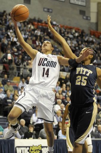 UConn's Bria Hartley goes for a layup against Pitt's Shayla Scott in their Big East game Saturday at Gampel Pavilion.
